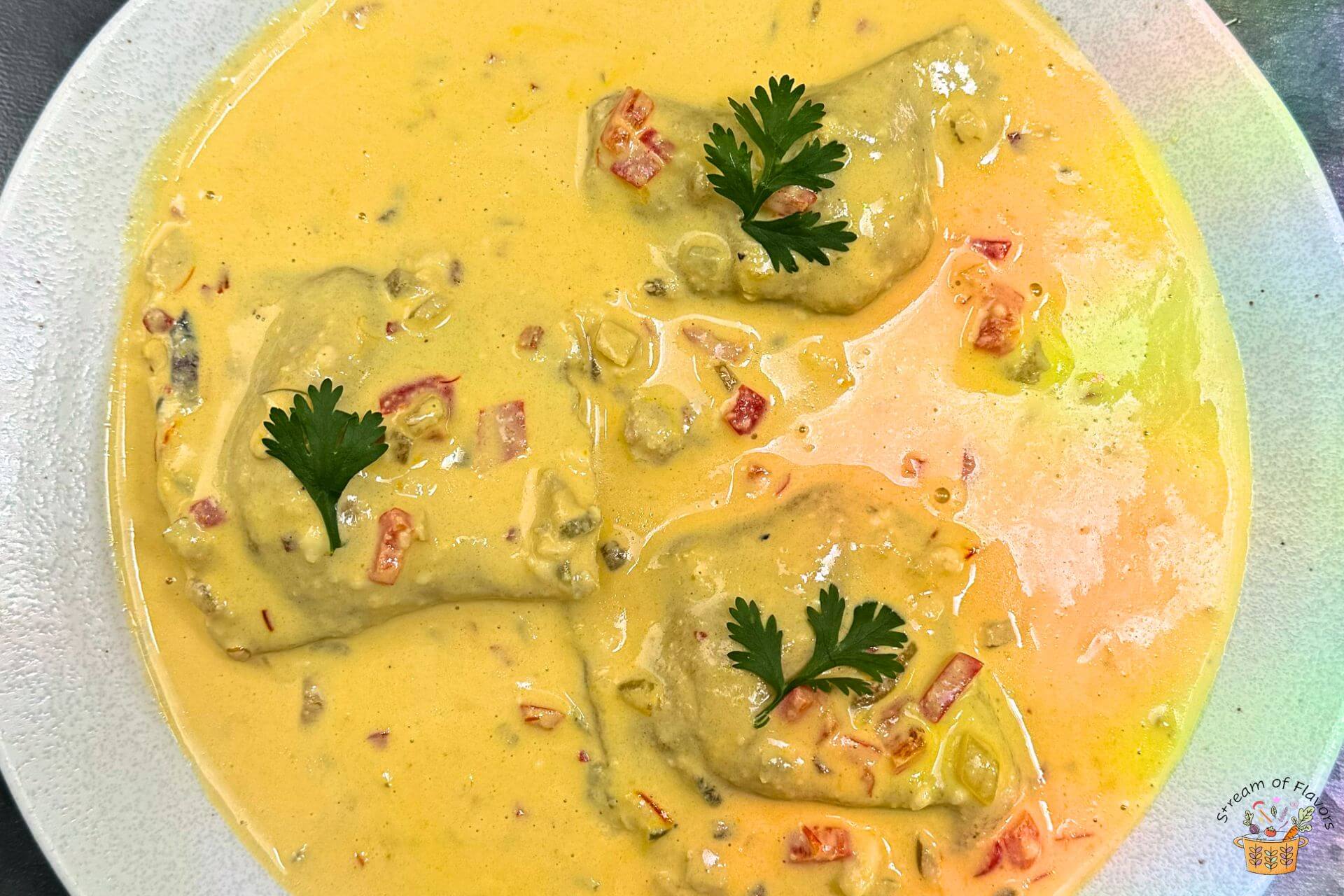 homemade lobster ravioli with cashew cream sauce and peppers