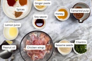 measured ingredients in bowls for the chicken wings