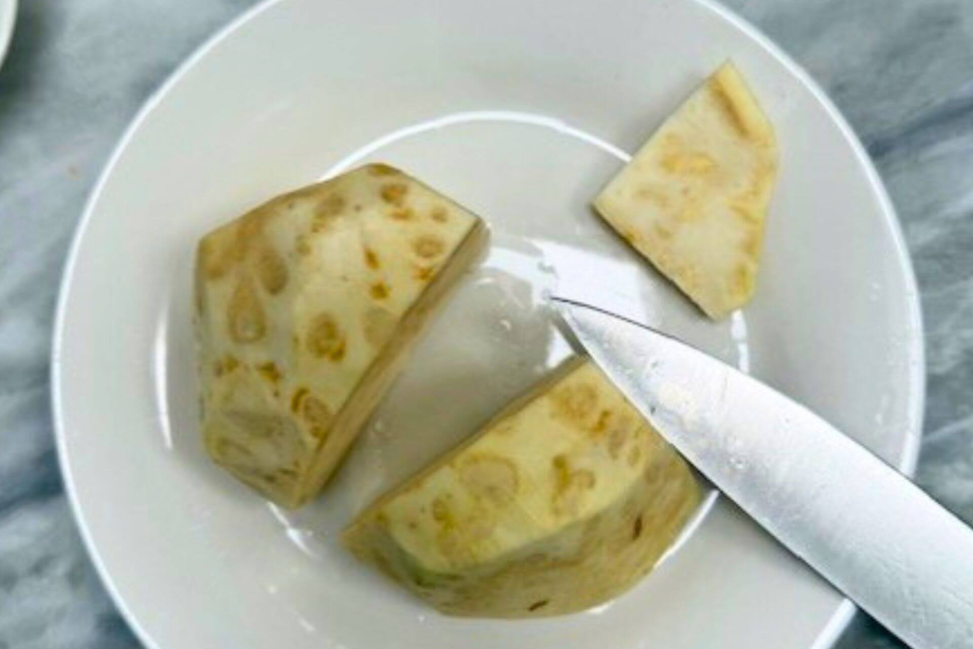 celery root quartered with a sharp knife