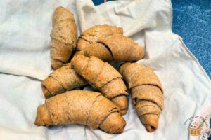 whole wheat croissants in a white napkin