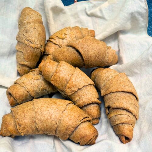 whole wheat croissants in a white napkin