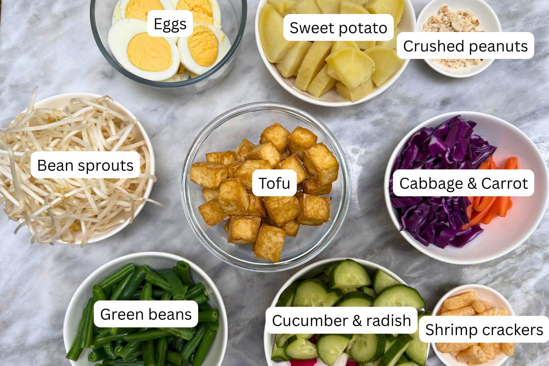 ingredients in bowls for the gado gado salad recipe