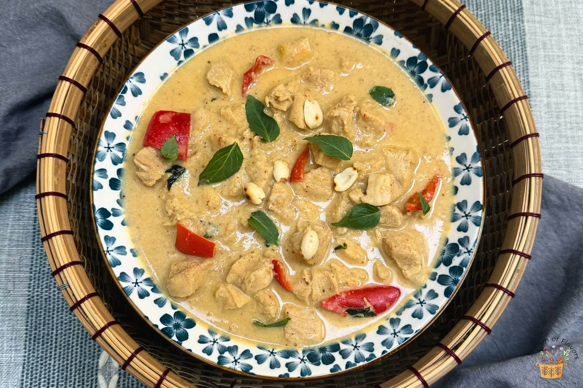 Panang chicken curry made with my recipe in a bowl garnished with basil leaves