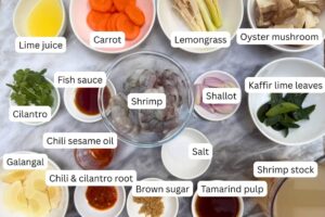 measured ingredients in bowls for tom yum goong recipe