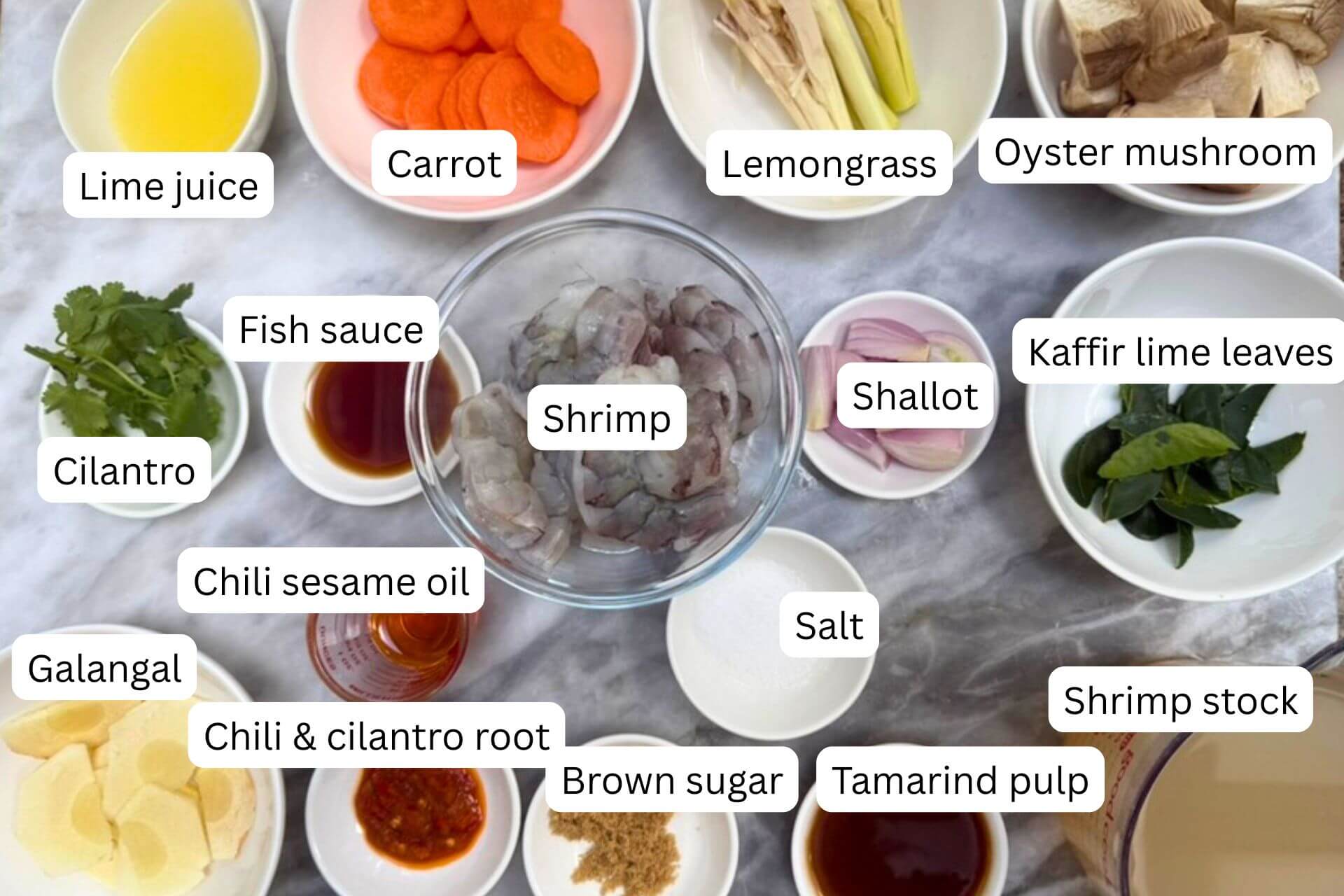measured ingredients in bowls for tom yum goong recipe