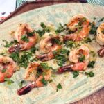 Easy garlic butter shrimp recipe garnished with parsley