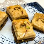Lebanses baklawa garnished with pistachios and saffron