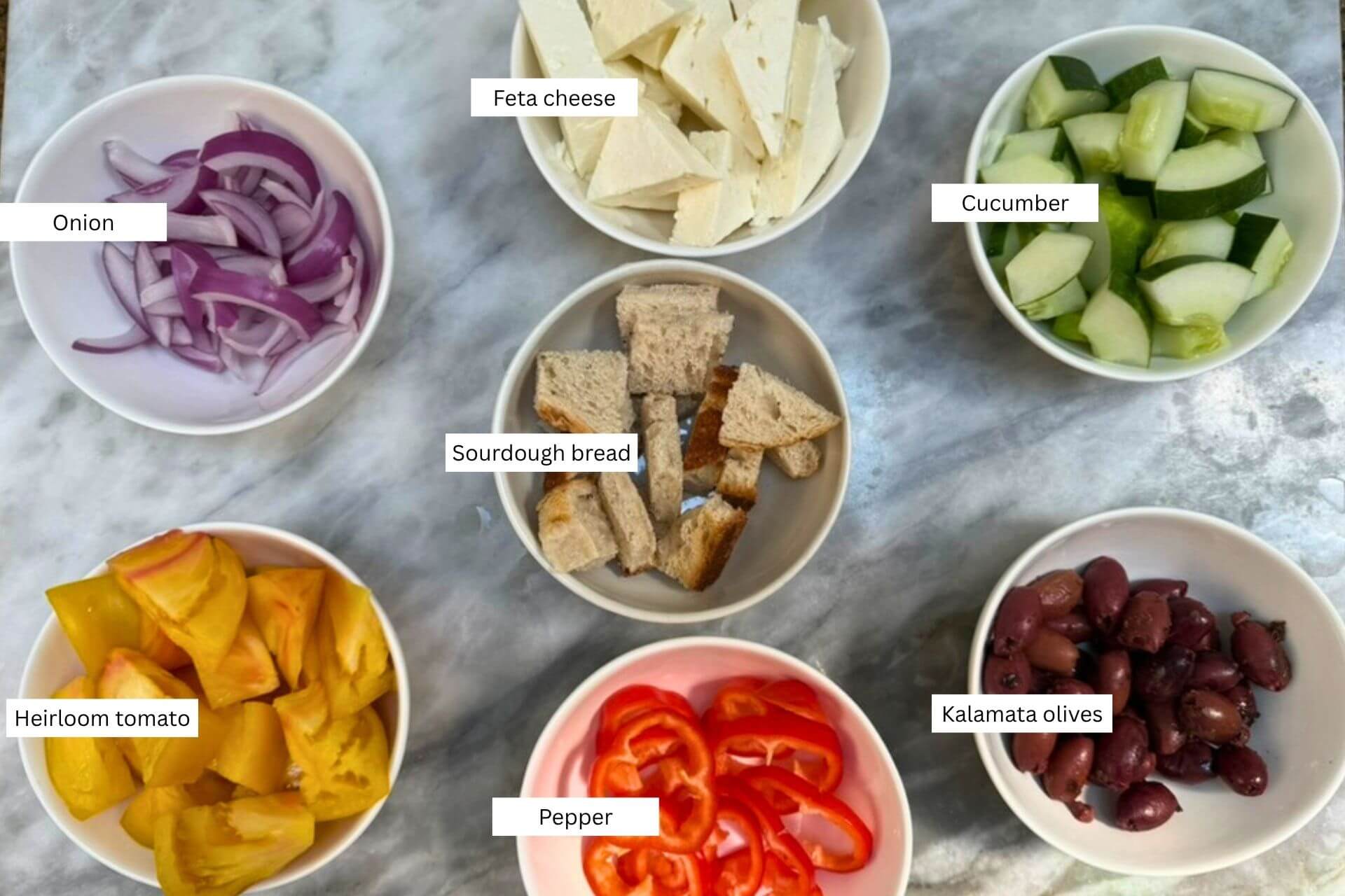 horiatiki salad ingredients in bowls