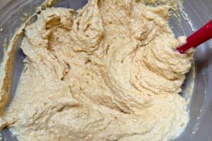 flours and orange puree folded into the mixture.