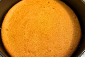 baked whole orange cake in a pan