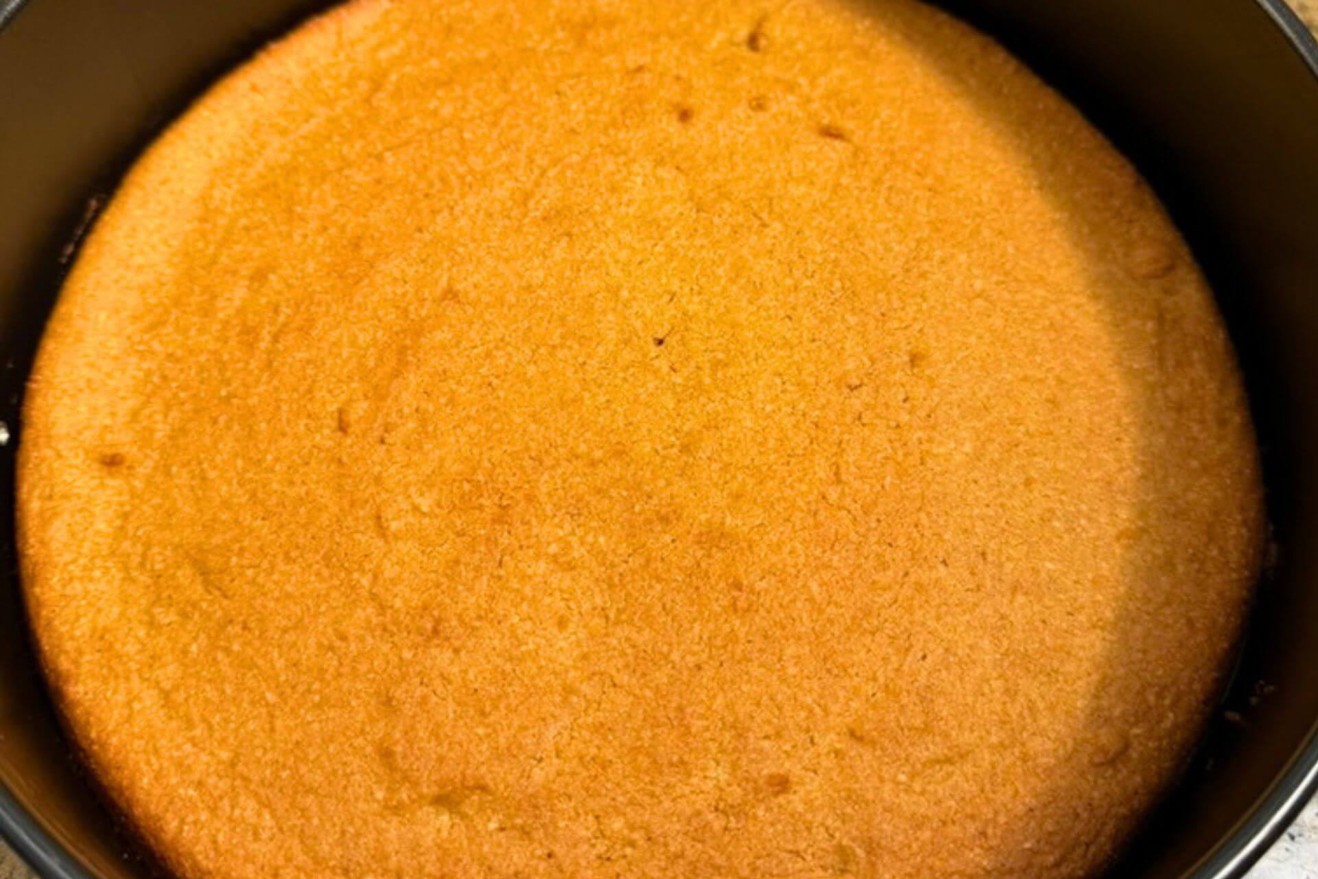 baked whole orange cake in a pan